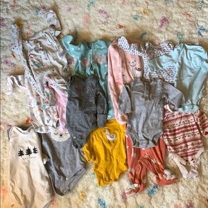 14 baby onesies sizes NB- 0-3months. Worn 1 time.